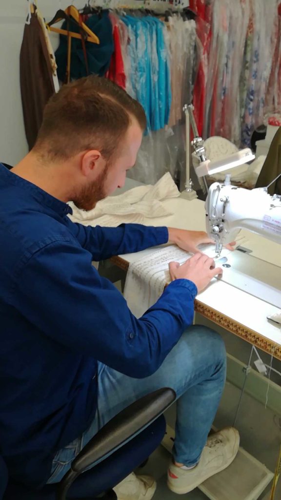 Figure 2 : Me learning how to sew in the haute-couture workshop